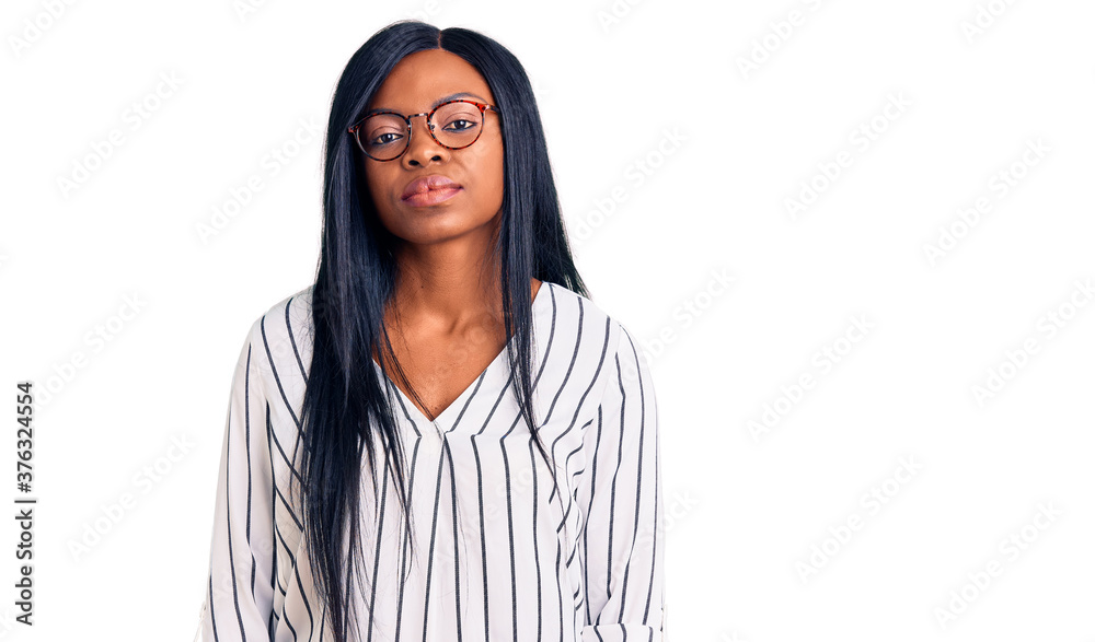 Young african american woman wearing casual clothes and glasses looking sleepy and tired, exhausted for fatigue and hangover, lazy eyes in the morning. Young african american woman wearing casual clothes and glasses looking sleepy and tired, exhausted for fatigue and hangover, lazy eyes in the morning.