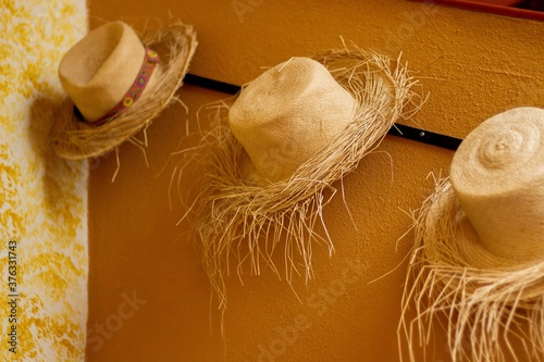 Straw hats on a wall