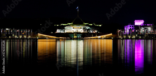 Canberra Skyline with a reflection in the waters of Lake Burley Griffin. photo