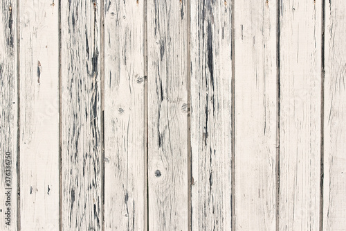 Painted wood structure with cracks, white with blue veins.