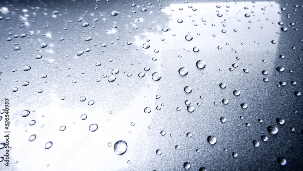 Gray automobile surface texture with rain droplets Gray automobile surface texture with rain droplets