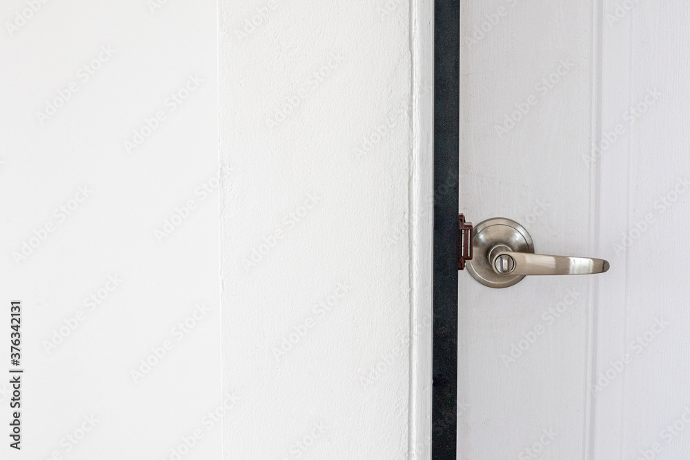 Metal door handles on modern wooden doors. Metal door handles on modern wooden doors.
