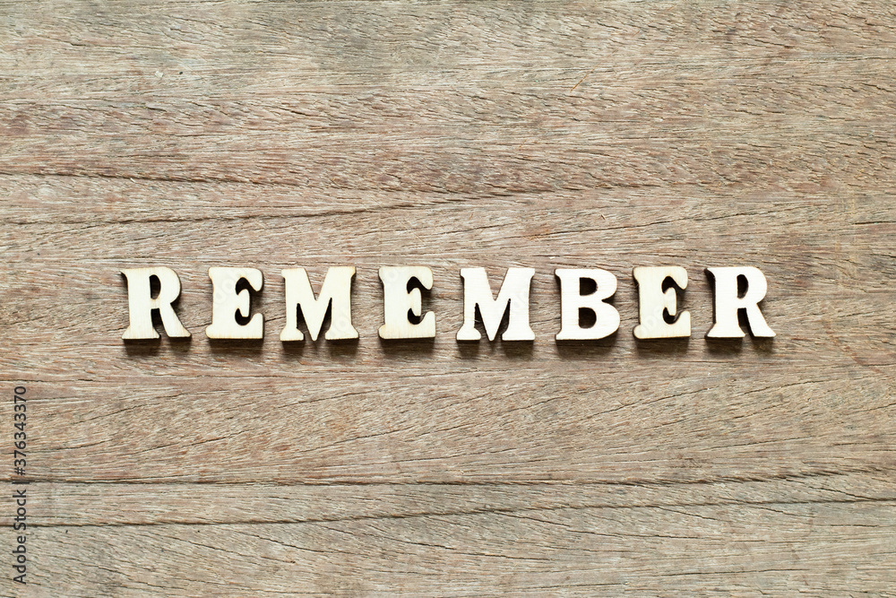 Alphabet letter block in word remember on wood background Alphabet letter block in word remember on wood background
