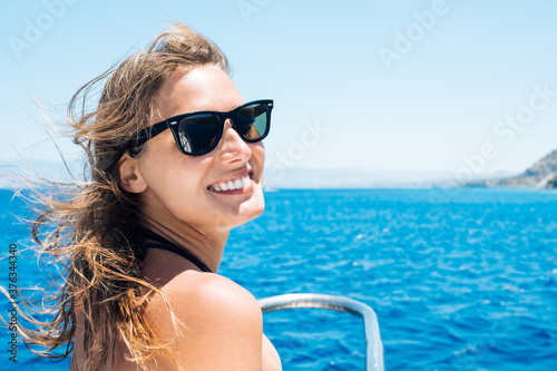 Happy female tourist having fun on sailboat © filistimlyanin1