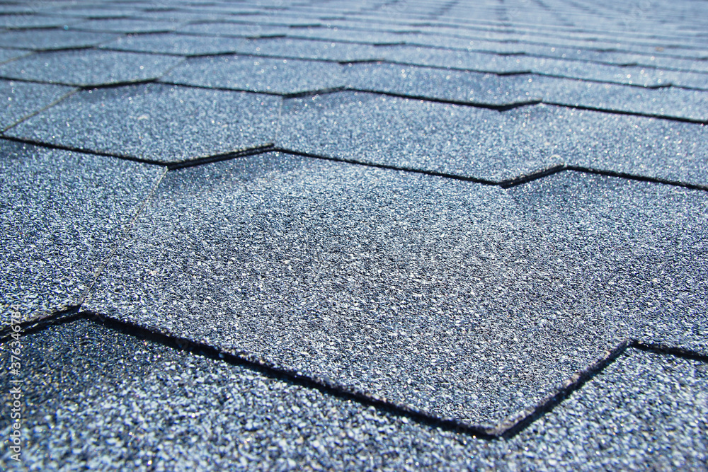 Obraz premium Gray soft roof on the roof of the house. Close-up.