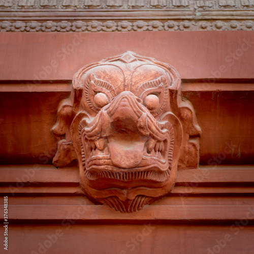 Indonesian style Hindu stone sculpture carved on the external wall of historical palace of Baron Empain, located in Heliopolis district, Cairo, Egypt photo