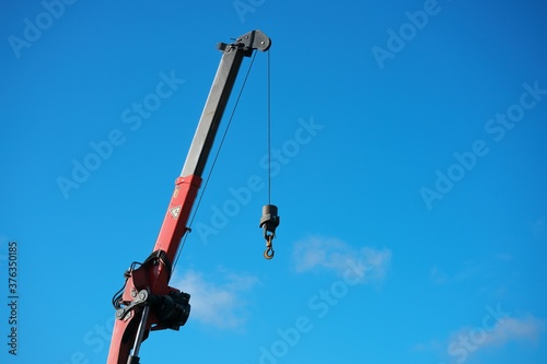 close-up of a crane boom with a hook.