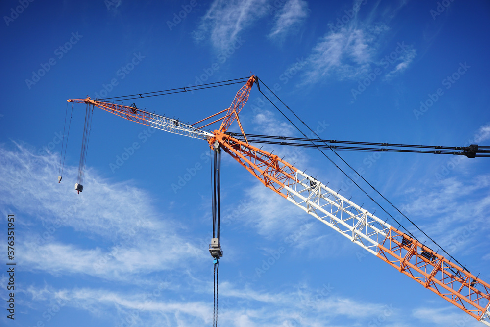 Large industrial crane in sky