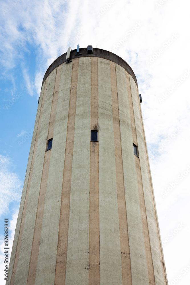 Lovanger, Norrland Sweden - August 2, 2020: water tower with windows seen from the ground