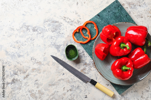 Composition with red bell pepper on light background