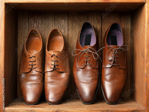 Leather male shoes in wooden box
