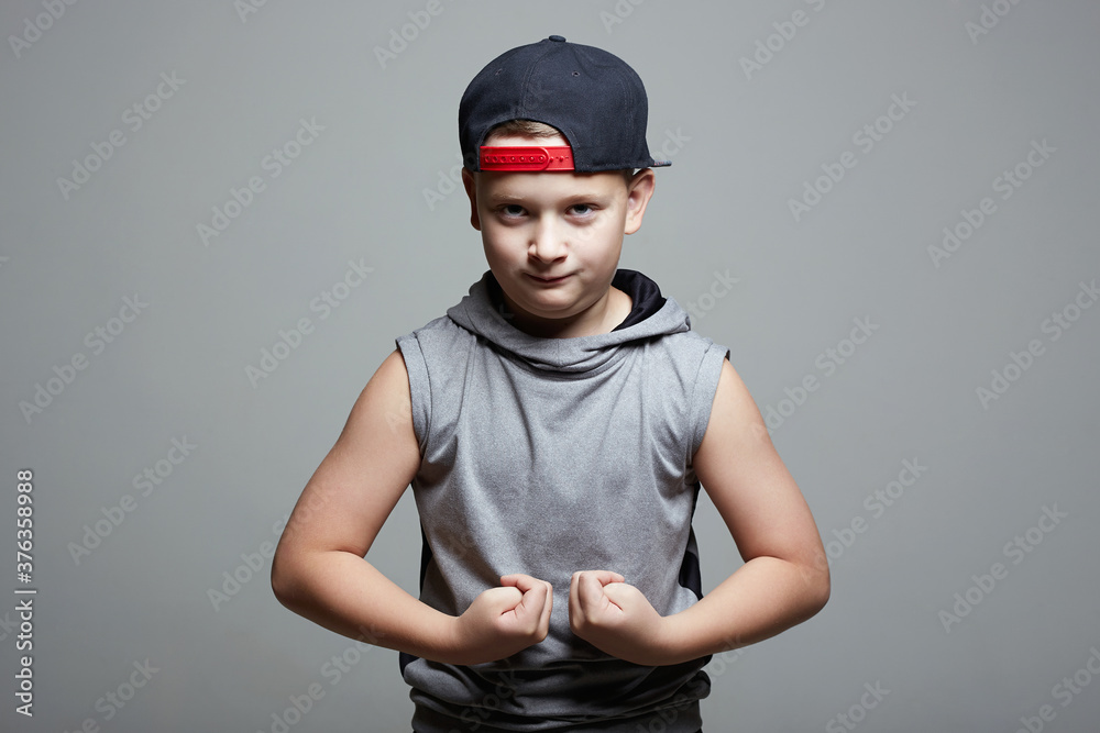 Young bodybuilder showing his hand biceps muscles Young bodybuilder showing his hand biceps muscles