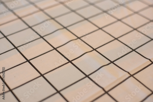 A White tablecloth with black grid stripes