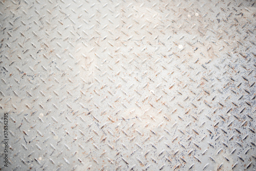 The old metal plate painted white rust