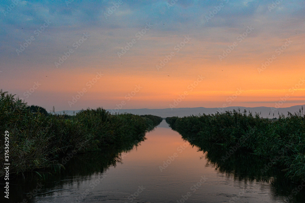 sunset colors with water canal 