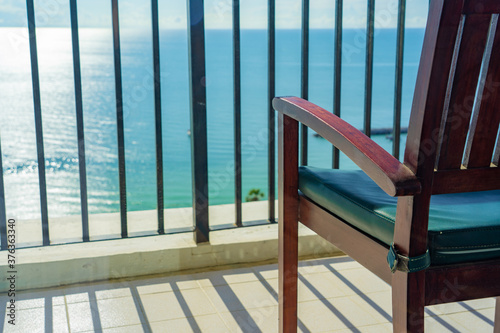 Chair at hotel balcony with sea view in Thailand, High angle