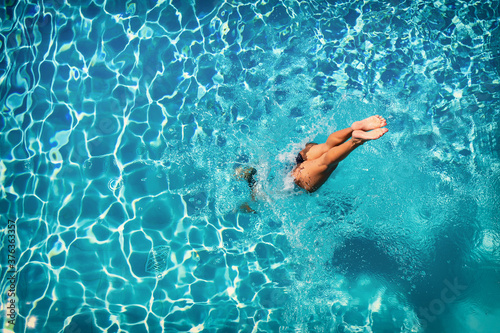 woman in luxury spa resort near the swimming pool. photo