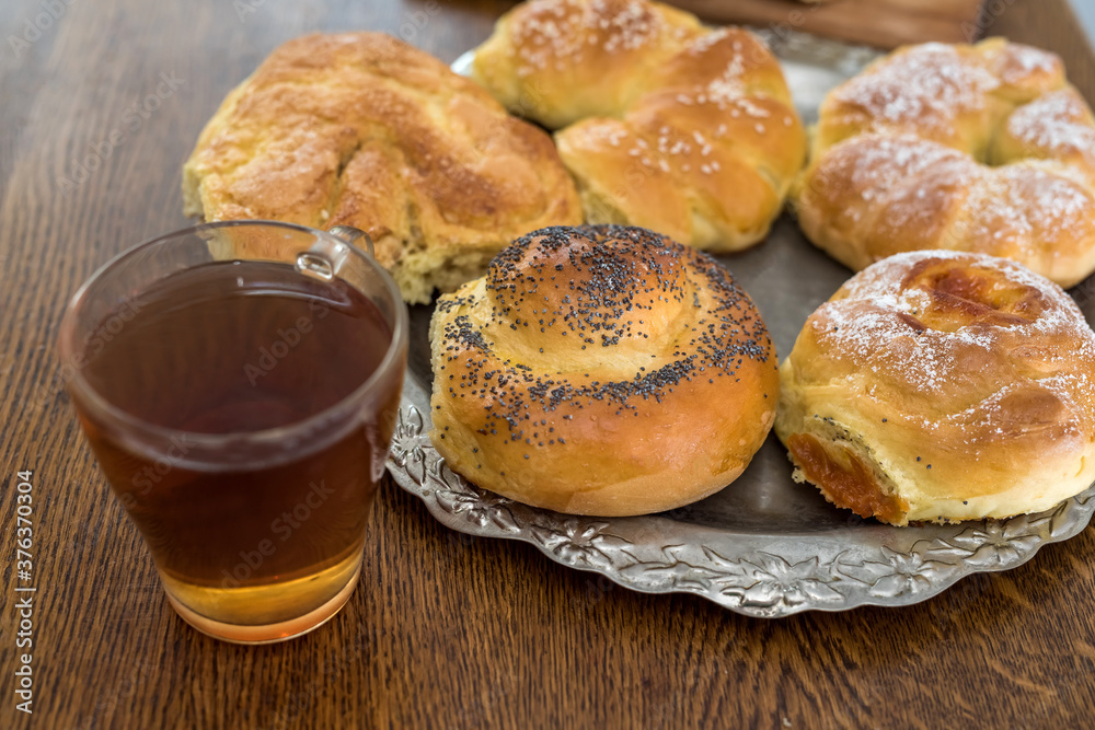 fresh tasty homemade buns with cup of coffee
