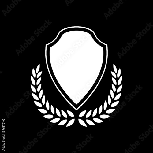 Simple shield logo and icon isolated on dark background