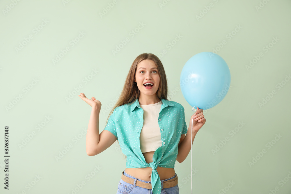 Young woman with balloon on color background Young woman with balloon on color background