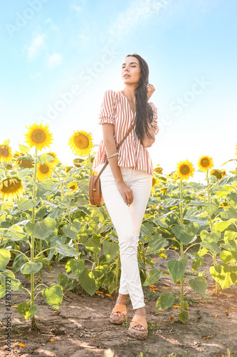 Beautiful young woman in su...