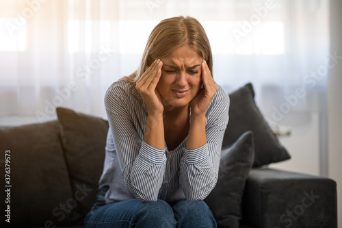 Bilde på lerret Young woman is tired after work