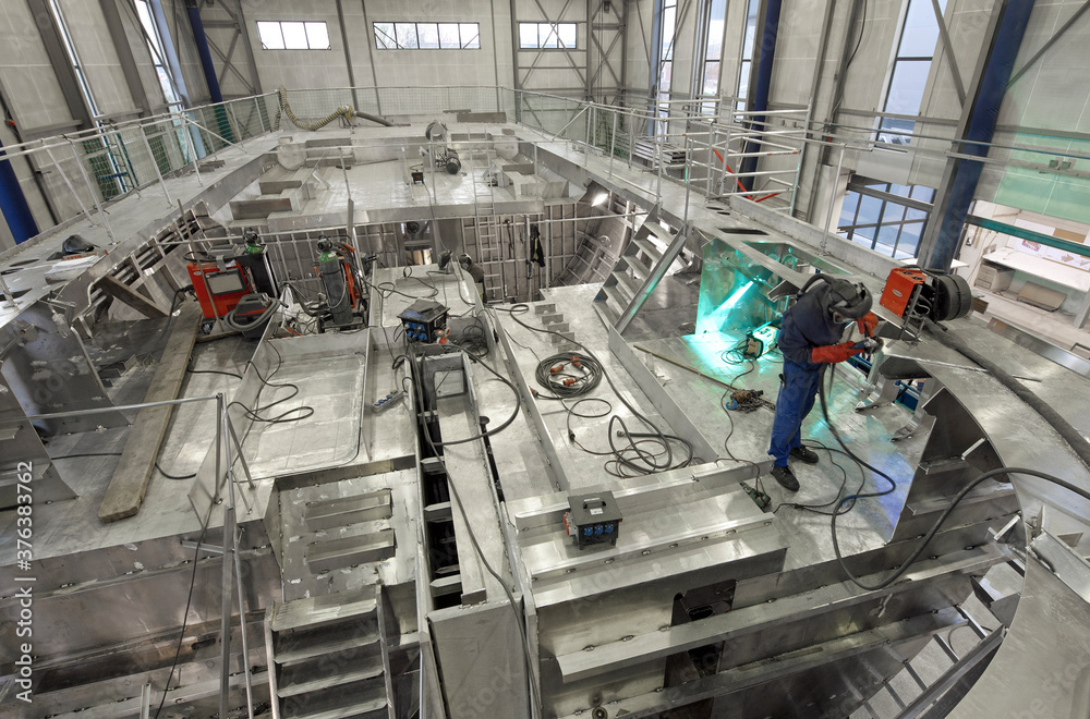 Welding. Aluminium hull of a yacht at the shipyard. Airframe. Ship building industry. Super sailing yacht. Netherlands. 