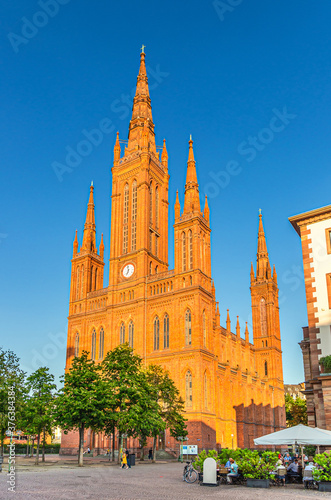 Evangelical Market Protestant church Wiesbaden or Marktkirche neo-Gothic style building on Schlossplatz Palace Square in historical city centre, blue sky background, State of Hesse, Germany