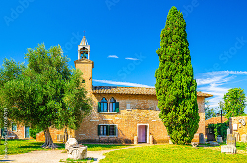 Provincial Museum of Torcello (Museo Provinciale di Torcello) building and Attila Throne ancient stone chair on Torcello island in Venetian Lagoon, Veneto Region, Northern Italy photo