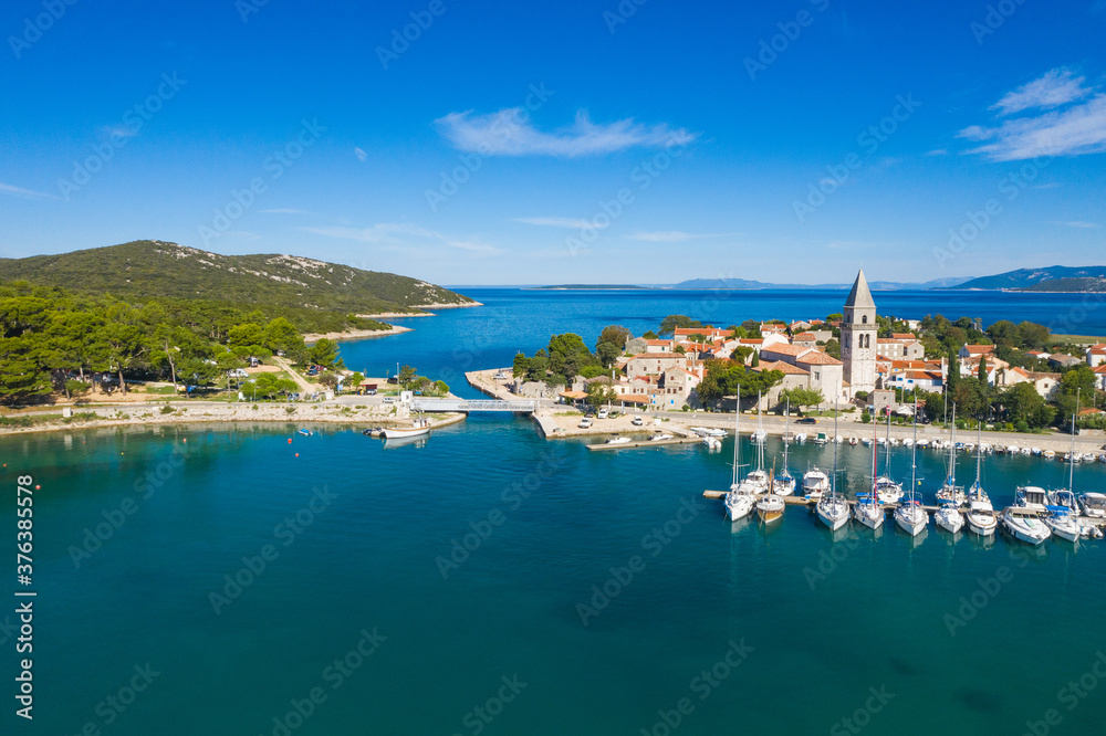 Beautiful old historic town of Osor with bridge connecting islands Cres and Losinj, Croatia, aerial view from drone
