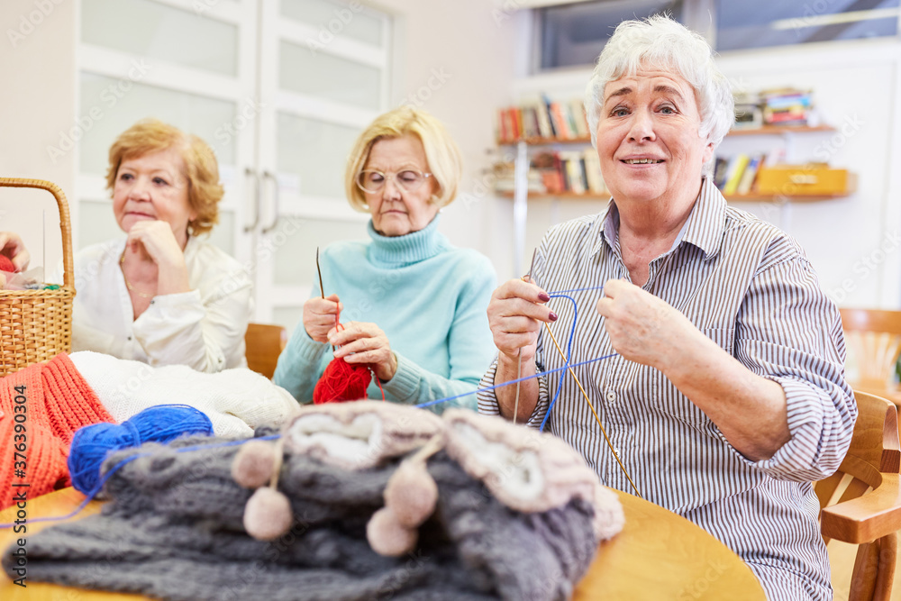 Three senior women crocheting and knitting Three senior women crocheting and knitting