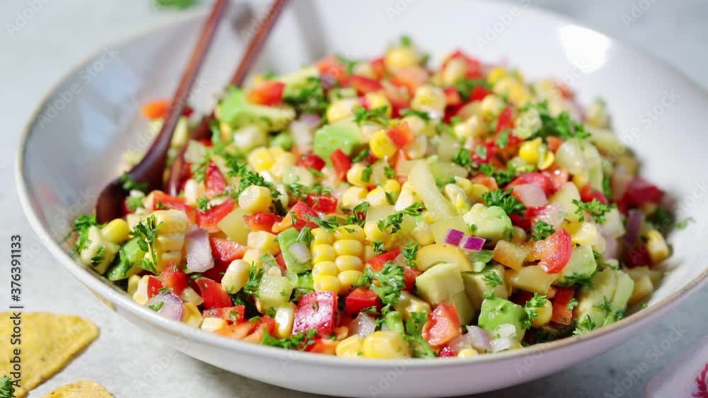 Corn salad in white plate. Mexican food concept. Corn salad in white plate. Mexican food concept.