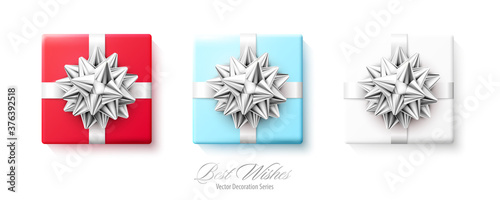 Set of gifts boxes with silver red bows and ribbons isolated on white background
