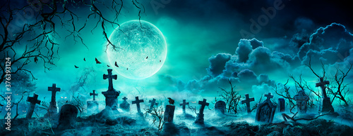 Fotografiet Graveyard At Night - Spooky Cemetery With Moon In Cloudy Sky And Bats