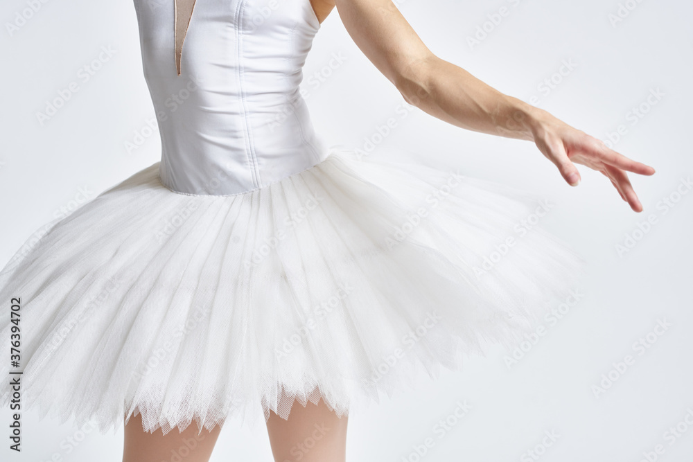 Naklejka premium Ballerina in white tutu elegant dance performed sensuality silhouette light background