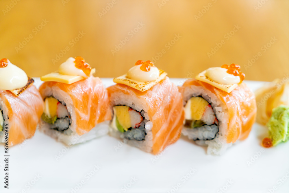 salmon roll sushi with cheese on top salmon roll sushi with cheese on top