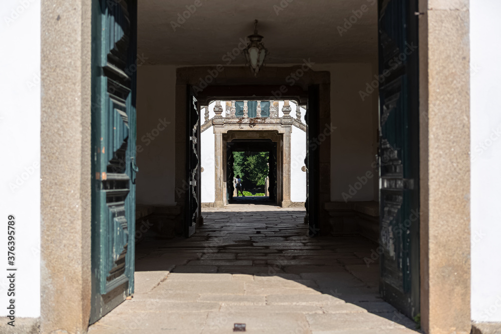 View of the Solar de Mateus interior building, door with nice view to the exterior garden View of the Solar de Mateus interior building, door with nice view to the exterior garden