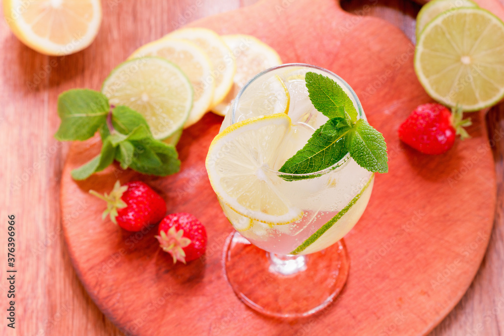 Glass of sparkling lemonade with mint and ice. Glass of sparkling lemonade with mint and ice.