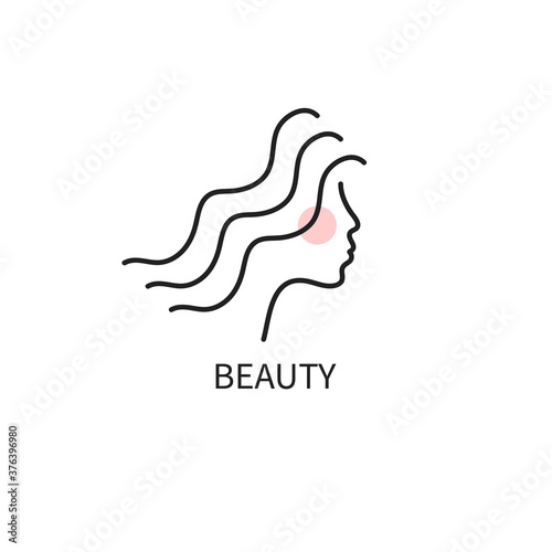 Profile of a young female face with wavy hair