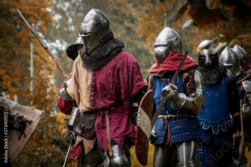 medieval knights on the march in the forest