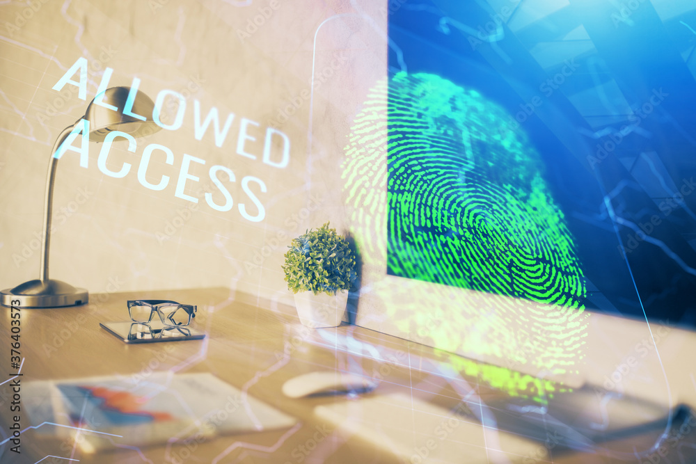 Computer on desktop in office with finger print drawing. Double exposure. Concept of business data security.
