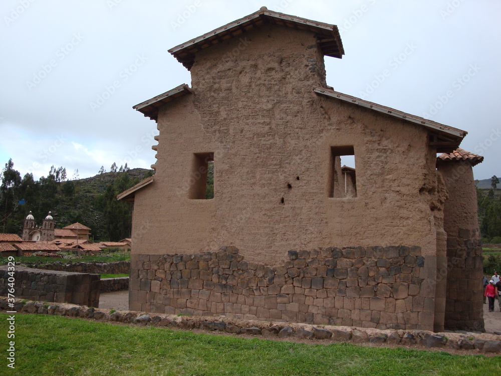 Villages and stonework near Cusco, Peru. sky green stone structures buildings fountains