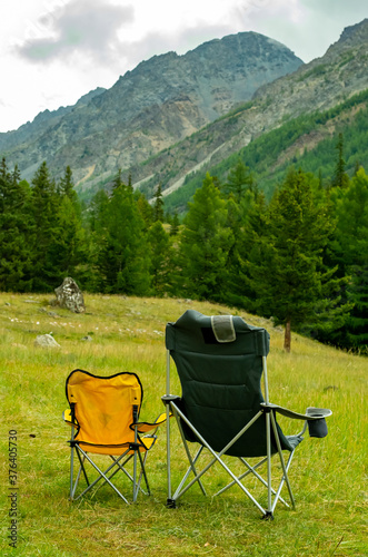 Two chairs in a camping in the mountains
