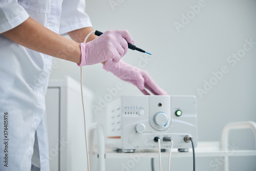Doctor getting ready for an electrosurgical procedure photo