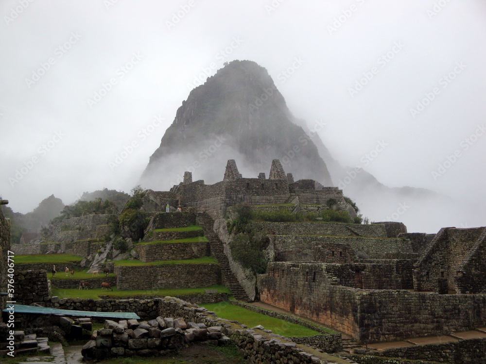 Incan ruins at Machu Picchu in the mist