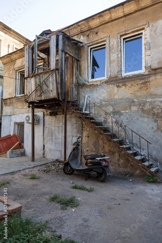Fototapeta Naklejka Na Ścianę i Meble -  A colorful landscape of ruined houses in a poor neighborhood for poor people. Construction of a poor state. , Architecture of the poor neighborhood. An old house in the area of smells