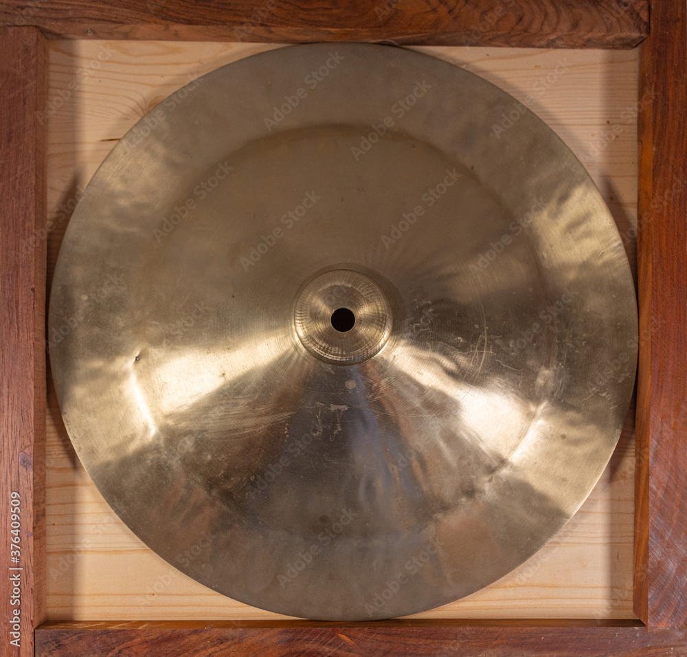 Close up of a bronze musical cymbal. Concept of metal processing