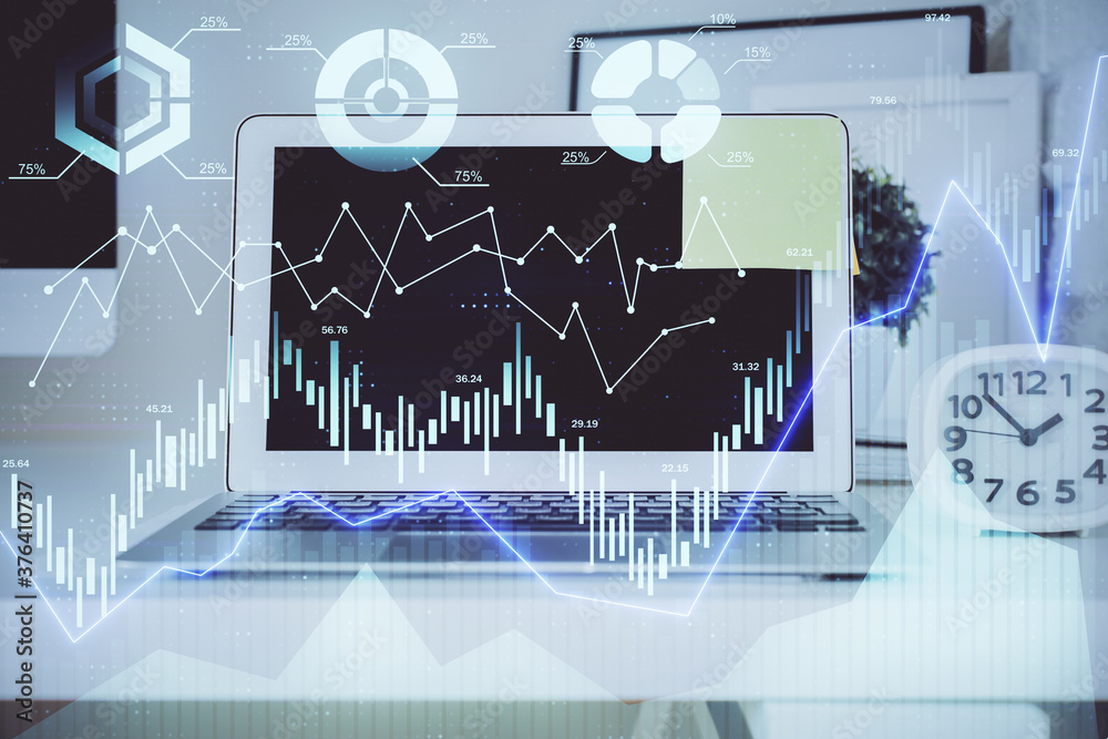 Forex Chart hologram on table with computer background. Double exposure. Concept of financial markets. Forex Chart hologram on table with computer background. Double exposure. Concept of financial markets.