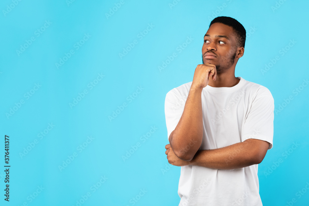 Thoughtful African Man Thinking Looking Aside Posing Over Blue Background Thoughtful African Man Thinking Looking Aside Posing Over Blue Background