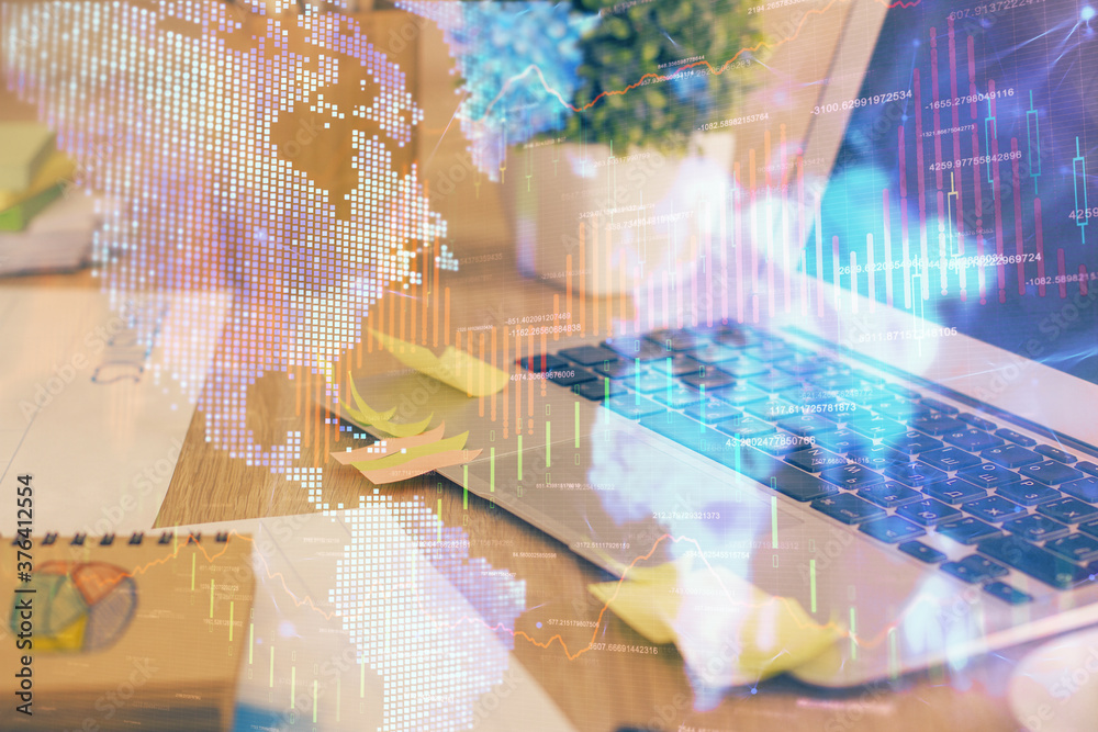 Fototapeta premium Multi exposure of chart and financial info and work space with computer background. Concept of international online trading.